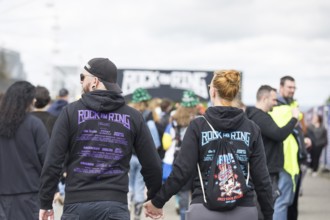 Two festival visitors with Rock am Ring jumpers at the Rock am Ring Festival on Friday, Nürburgring