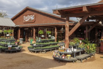 Plants and pots for sale outside the Brew Bonnet Biergarten at the Wildseed Farms nursery in