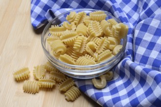 Italian pasta in a glass bowl, Radiatori variety