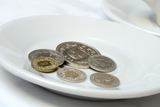 Tip, Swiss coins on plate, Switzerland