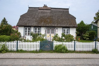 White thatched house with lovingly designed front garden. Wieck, Mecklenburg-Western Pomerania,