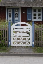 Decorated garden gate with carved fish, Wieck, Mecklenburg-Vorpommern, Germany