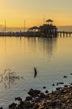 Biloxi Schooner Pier Complex at sunset on the Gulf of Mexico at Biloxi, Mississippi, USA
