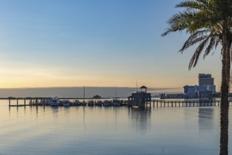 Biloxi Schooner Pier Complex at sunset on the Gulf of Mexico at Biloxi, Mississippi, USA