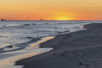 Oil and gas drilling rigs on the Gulf of Mexico horizon at Fort Morgan, Alabama, USA