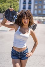 Stylish young woman holding her skateboard on her shoulder, showcasing a blend of confidence and