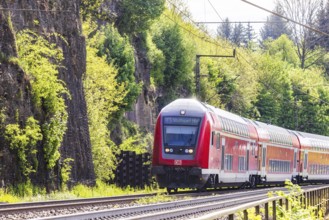 Regional express RE5 en route on the winding railway line of the Geislinger Steige. Landscape along