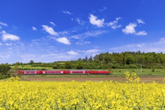 RegionalExpress RE5 en route on the Swabian Alb. Landscape along the railway line in spring.