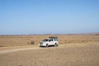 Off-road car on a sandy track, Brandberg, Damaraland, Namibia