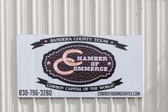 Sign for the Bandera County Chamber of Commerce in Bandera, Texas, USA