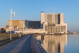 Concrete walkway along the Biloxi waterfront next to Margaritaville and Golden Nugget casinos in
