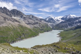 Blue mountain lake in a mountain landscape with glaciers, Lac des Dix reservoir and Mont Blanc de