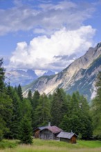 Alpine huts at Passo Cibiana, near Cibiana di Cadore, Dolomites, Trentino, Italy