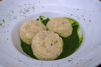 Dumplings on herbs, at Rifugio Ra Stua, Ra Stua Alm, Valon Scuro, near Cortina d'Ampezzo,