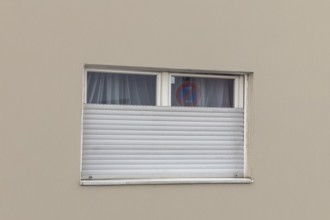 Broken roller shutter on a detached house