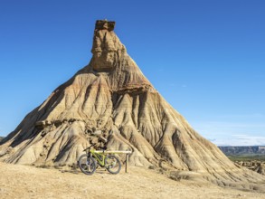 Castildetierra rock formation, single bicycle, semi-desert, Bardena Blanca area, Bardenas Reales