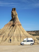 Camper van in front of Castildetierra rock formation, tourist, semi-desert, Bardena Blanca area,