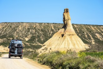 Camper van at Castildetierra rock formation, semi-desert, Bardena Blanca area, Bardenas Reales