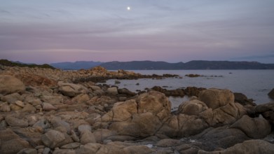 Sunset, rocky coast near Porto Pollo, Corsica, France