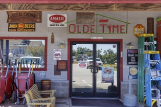 Antique metal advertising signs used for decoration on the side of the Olde Tyme Hardware and