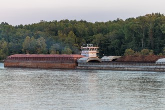 Tug boat pushing multiple barges on the Tennessee River near Savannah, Tennessee