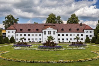 White castle with elaborately designed garden and colourful flower beds, The town of Kempten im