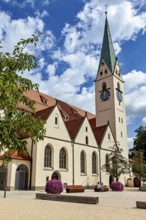 Gothic church with a red roof and well-tended flower pots, The town of Kempten im Allgäu
