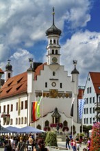 Magnificent baroque town hall surrounded by people and flags, The town of Kempten im Allgäu