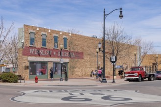 Tourists take photos Standin' on a Corner in Winslow Arizona as sung in the classic Glenn Frey and