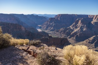 Colorado River runs between rock formations at Guano Point in Grand Canyon West near Peach Springs,