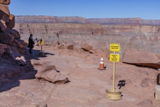 Sign warns of falling rocks at Guano Point area of Grand Canyon West near Peach Springs, Arizona