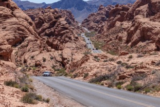 Traffic on Mouse's Tank Road winds between the red sandstone rock formations in Valley of Fire