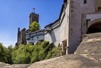 Castle walls with a view of the blue sky and flag, Wartburg Castle near Eisenach in Thuringia
