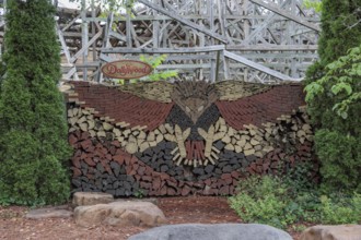 Mural of an eagle formed in stacked wood logs and boards at the Dollywood amusement park in Pigeon