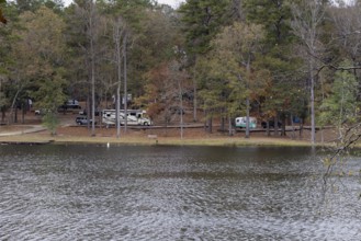 Modern and retro recreational vehicles at the campground near the shore of Ivy Lake in Clarko State