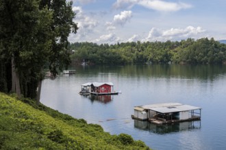 View of a house boats on Fontana Lake as seen from the open air car of the Great Smoky Mountains