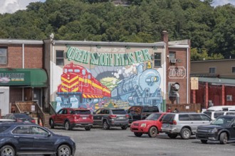 Mural on the back of a building welcomes Great Smoky Mountains Railroad passengers back to Bryson