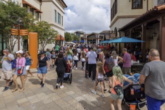 Crowd of visitors walking past The Polite Pig restaurant in Disney Springs at Disney World in