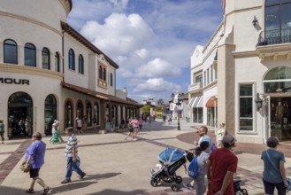 Shoppers and visitors walking in Disney Springs at Disney World in Orlando, Florida, USA