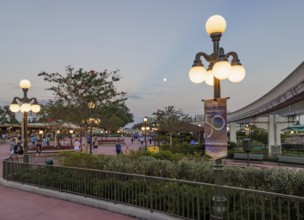 Moon in the sky in the early evening outside the entrance to the Magic Kingdom at Walt Disney World