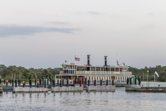 Water taxi General Joe Potter with passengers approaching the dock at the Magic Kingdom in Walt