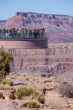 Visitors view the Grand Canyon from the Skybridge, a glass floored bridge extending 70 feet over