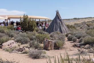 Native American cultural exhibits near the covered bus boarding area at the Eagle Point area of