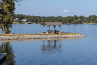 Pavilion with picnic tables on a peninsula at Beech Lake reservoir in Lexington, Tennessee
