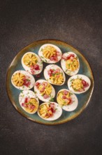 Spicy, stuffed ramen eggs, with bacon and green onions, homemade, no people