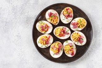 Spicy, stuffed ramen eggs, with bacon and green onions, homemade, no people