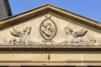 Stonework details pediment above entrance to King's and Queen's Baths, city of Bath, north east