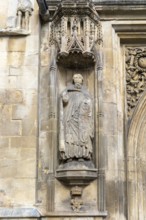 Carved stonework statue of Saint Peter, front of Abbey church, city of Bath, north east Somerset,