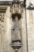 Carved stonework statue of Saint Paul, front of Abbey church, city of Bath, north east Somerset,