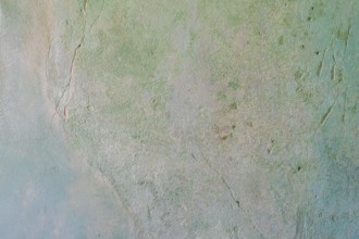 Greenish, cracked wall with rough texture and abstract appearance, background, texture,
